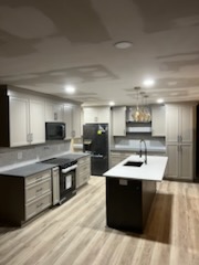 Custom kitchen cabinetry and island installed by Porter Carpentry