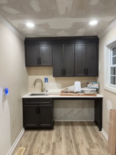 Custom wet bar cabinetry with countertop